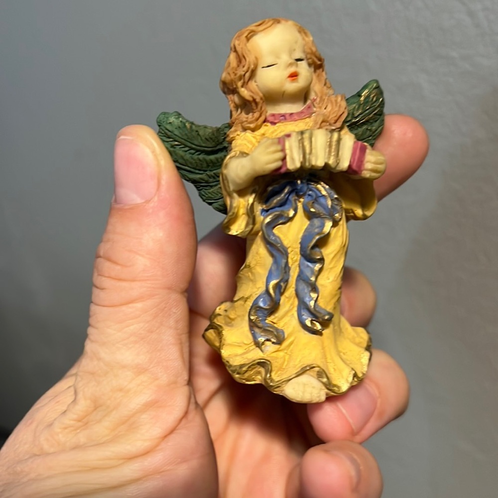 Vintage angel girl with wings and harmonic